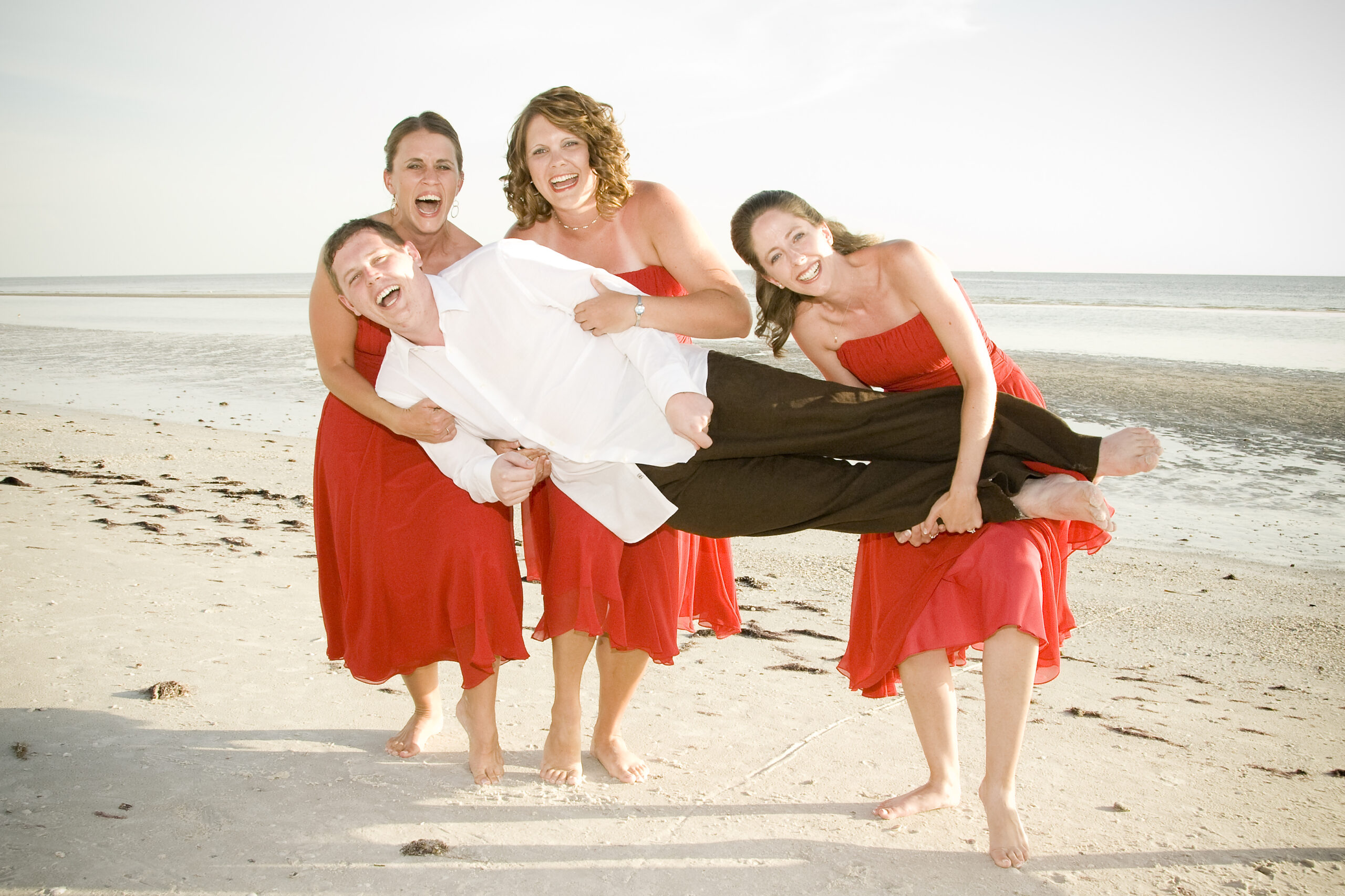 Wedding Day Photo Idea: Bridesmaids Hold the Groom!