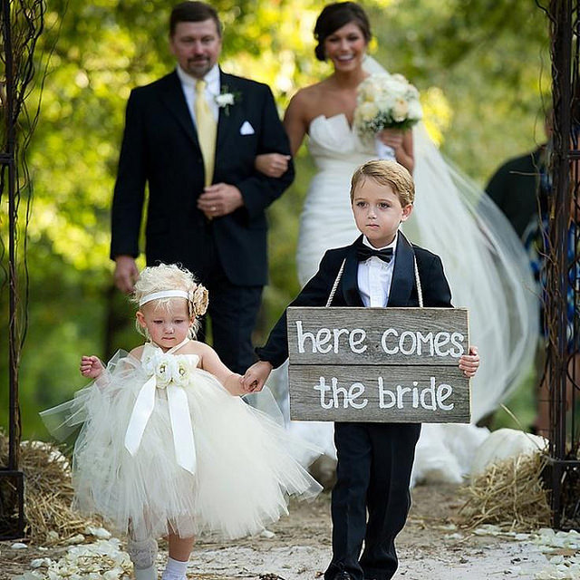 Flower Girl and Ring Bearer Act as Sign Bearer